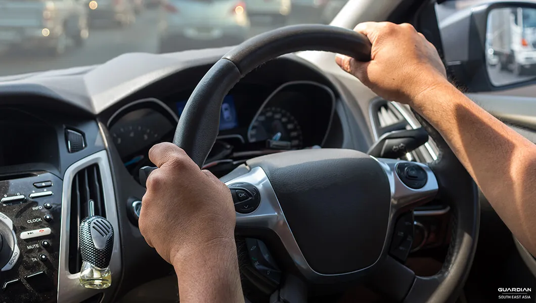 No More Distracted Driving How Machine Learning Can Improve Fleet Safety hands on the steering wheel
