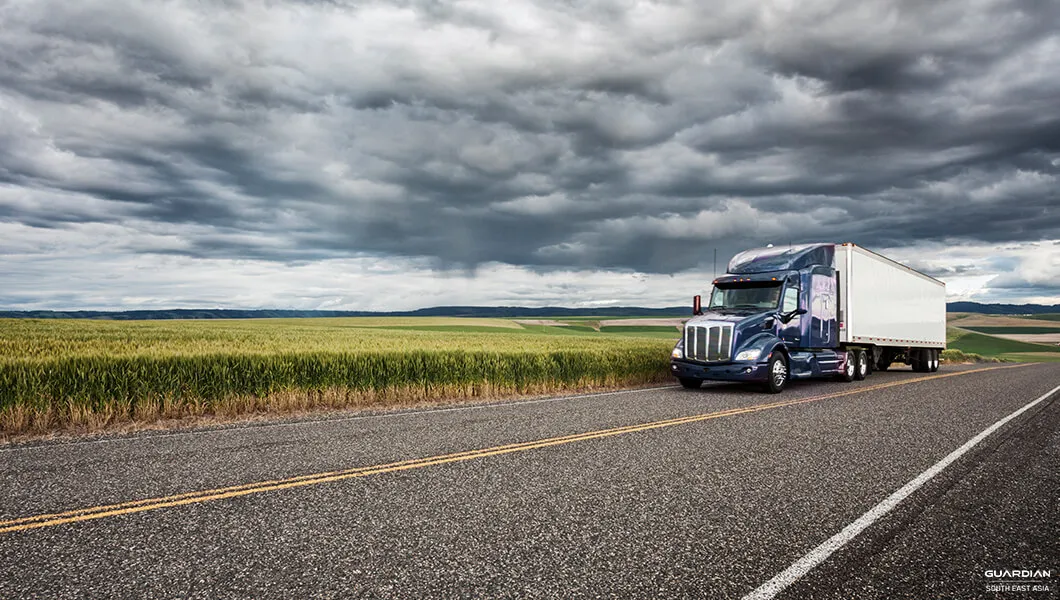 Preparing Your Fleet During Thunderstorms blue ten wheeler truck at roadside